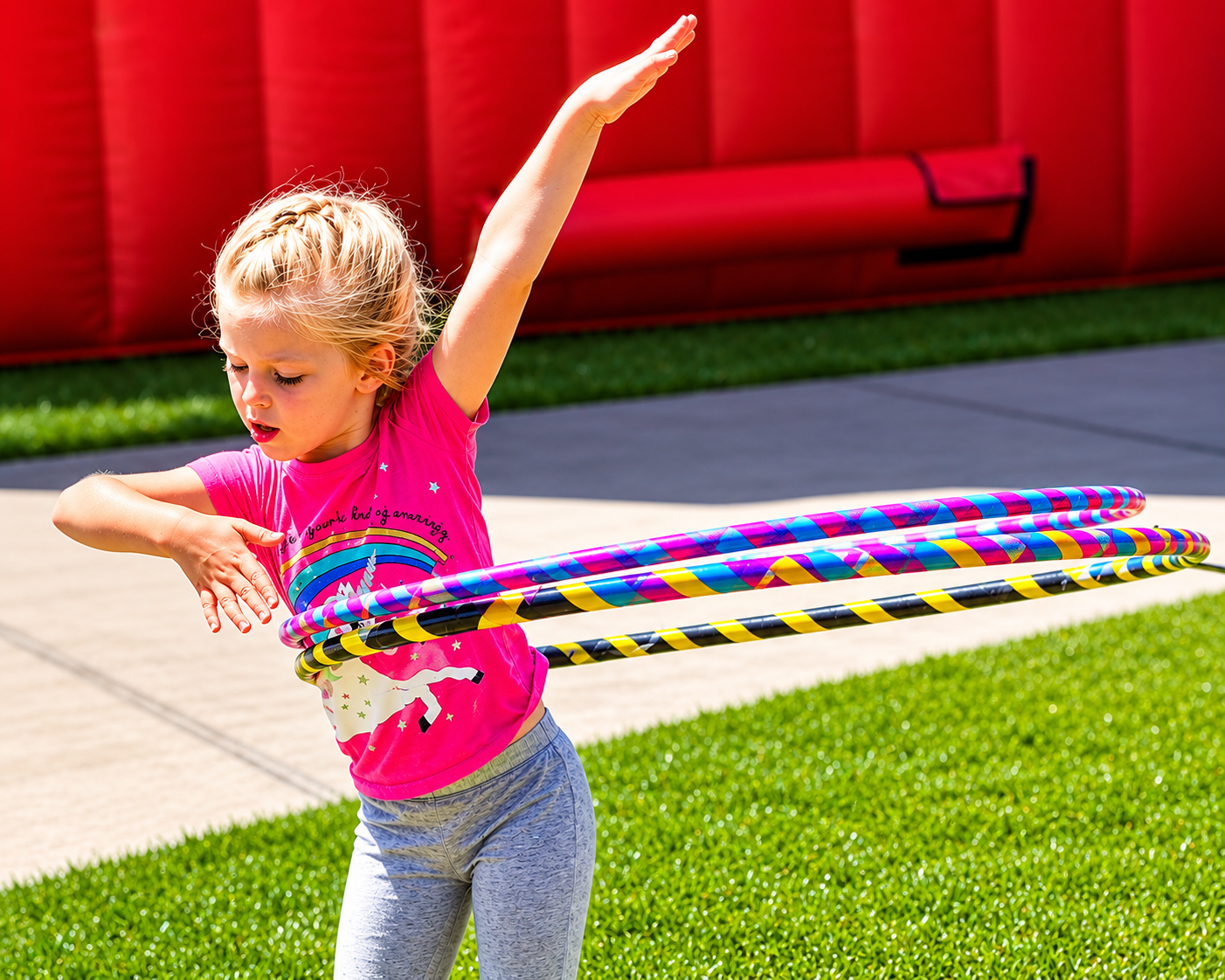 Girl with multiple small 1/2 inch hoops at a Sunshine Hoops event