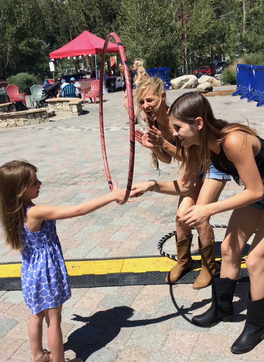 Sunshine Hoops instructor teaching a young girl how to hoop