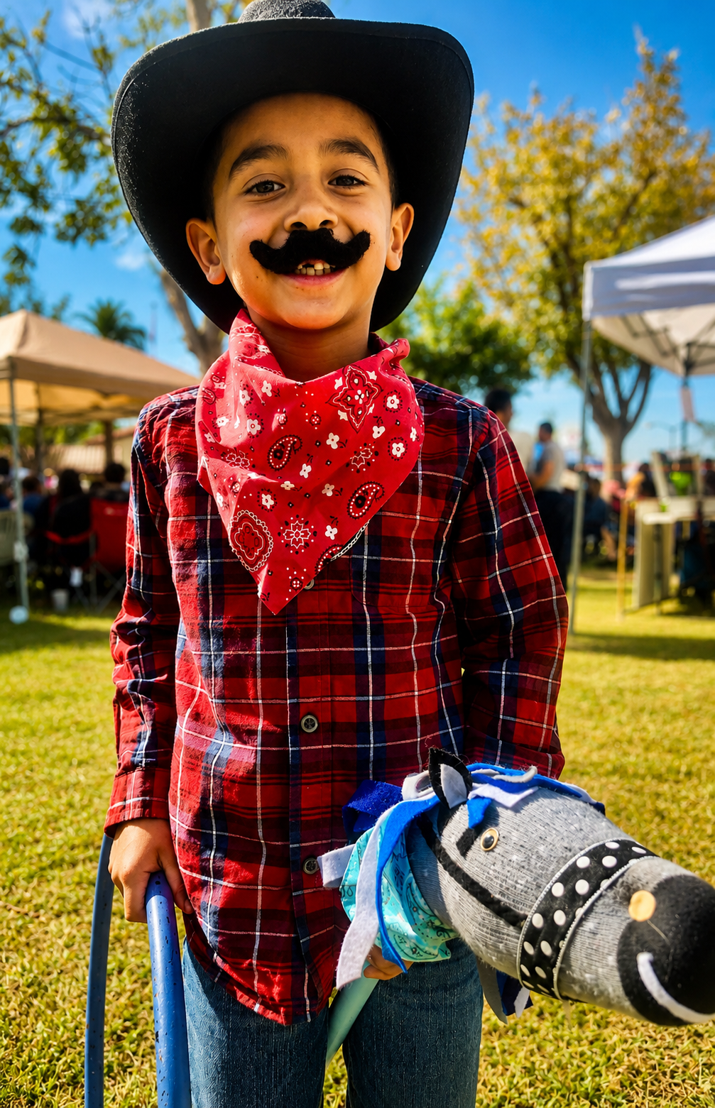 Adorable little cowboy at a Sunshine Hoops Stick-Pony Rodeo Party