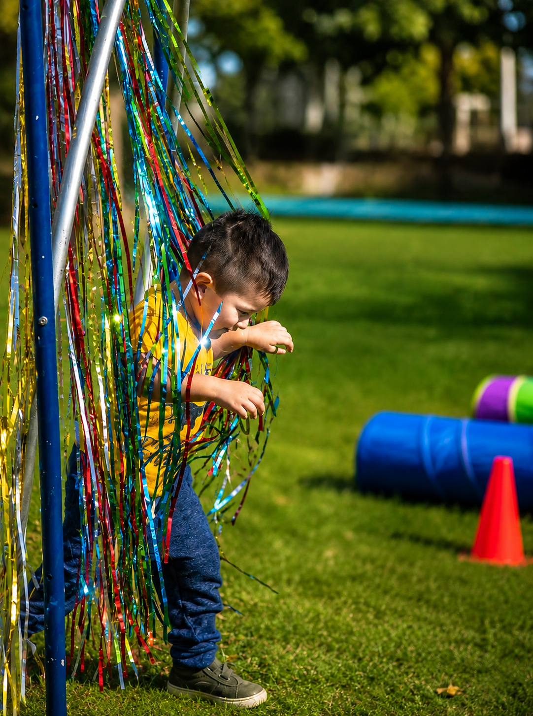 Child coming through the obstacle course at a Sunshine Hoops party