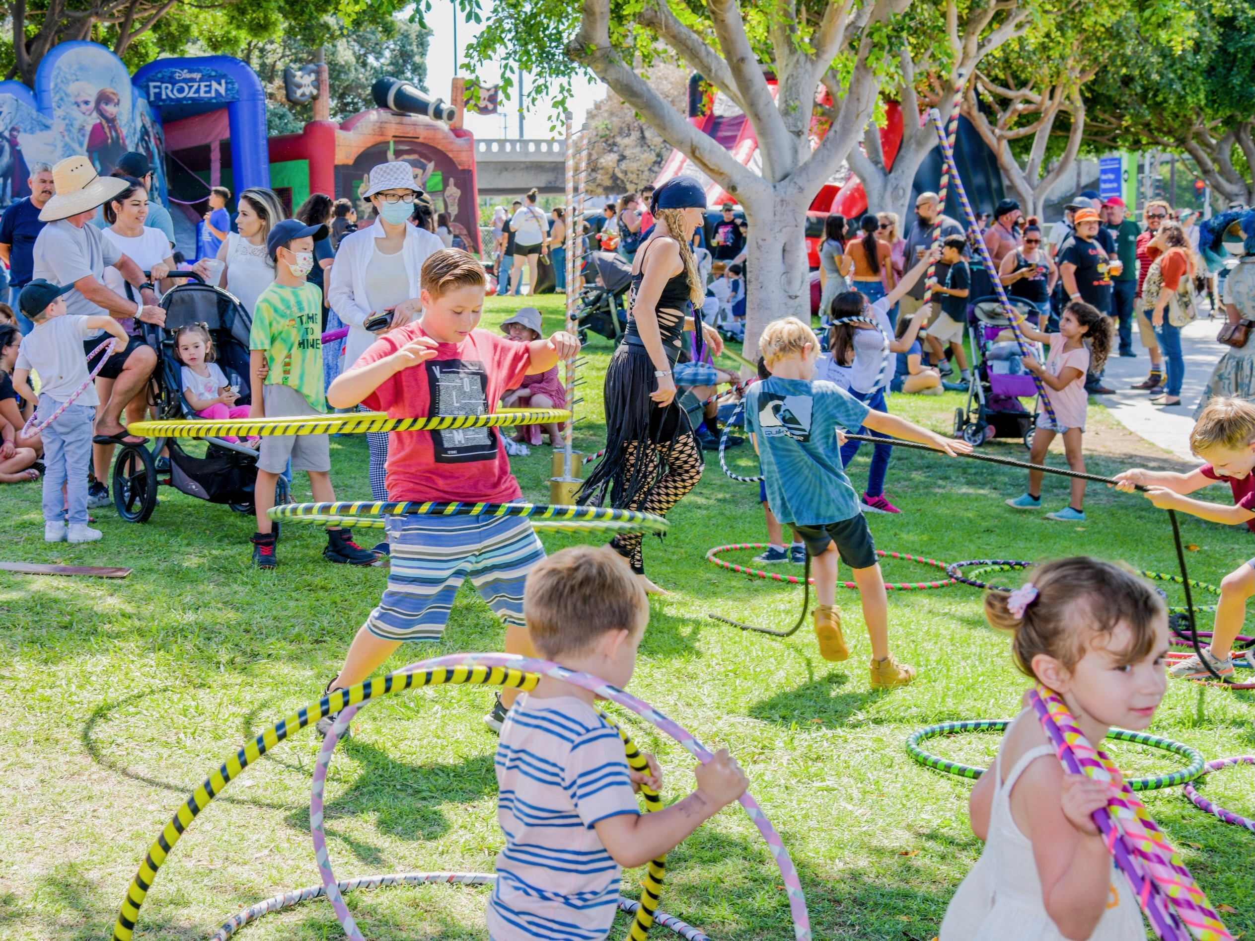 Large group of children hooping at outdoor community festival
