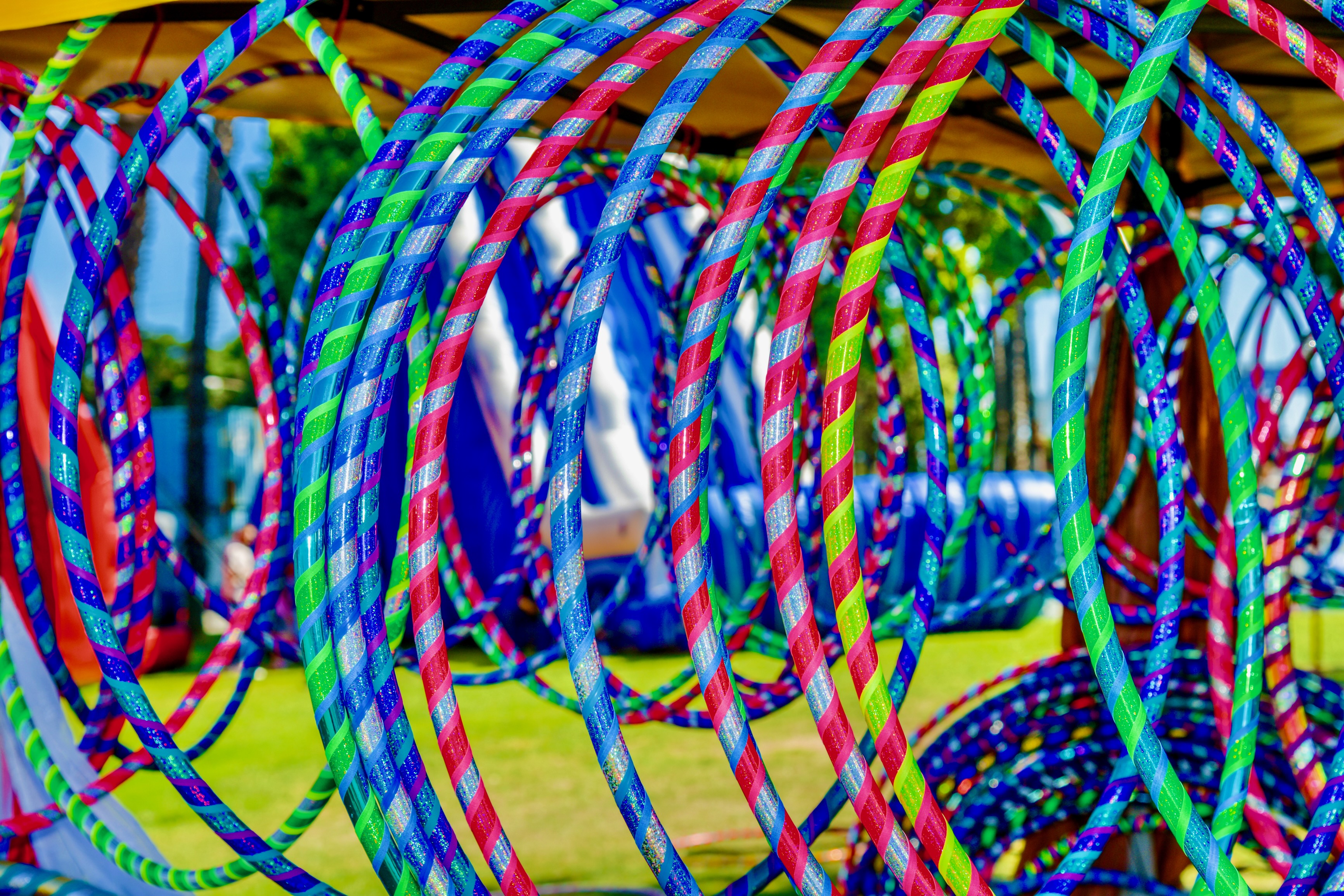 A rainbow of colorful custom Sunshine Hoops on display